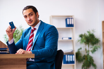 Young male employee working in the office