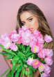 © Volodymyr - Sexy girl with flowers. Fashion model hold tulips, spring look,