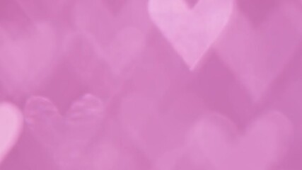 Wall Mural - Glowing heart shaped lights sparkling on soft pink background. Romantic Valentine's day background.