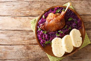 Canvas Print - Delicious, yet simple Bohemian style duck pecena kachna close-up in a plate on the table. horizontal top view from above