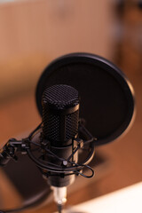 Wall Mural - Close up of microphone at recording studio, technology and audio equipment. Recording social media content with production microphone, digital web internet streaming station