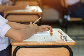 Wall Mural - asian hands student testing in exam on exercise taking at high school or university in test room. wr