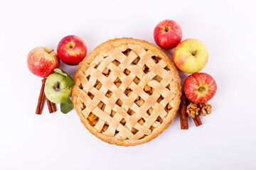 Wall Mural - Traditional American Thanks Giving pie, whole & halved apples, cinnamon sticks, anise seeds. Homemade fruit tart baked to golden crust with ingredients. Close up, copy space, top view, background.