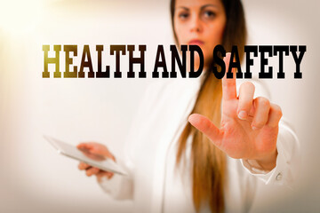 Poster - Text sign showing Health And Safety. Business photo showcasing procedures intended to prevent accident in workplace Model with pointing hand finger symbolizing navigation progress growth