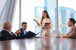 © torsakh - Executive business people wear suit have meeting and talking and discussing in conference room, leader present result and idea to the team by using tablet and document