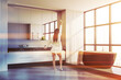 © ImageFlow - Woman in panoramic white bathroom corner