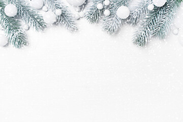 White festive Christmas background with christmas tree branches