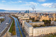 cityscape at sunrise on autumn morning with old houses, highways and river shot from drone