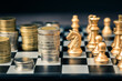 © patpitchaya - Money Coins Heap on Chessboard Game