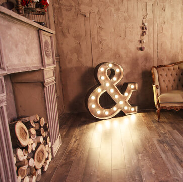 Big symbol with glowing lights in studio.