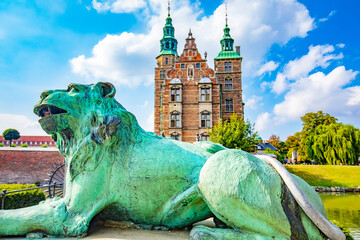 Fototapete - Rosenborg Castle in Copenhagen, Denmark. Selective focus on a lion on foreground.