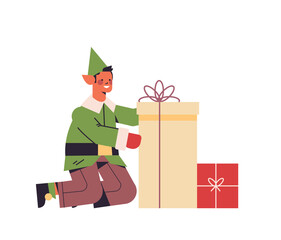 Wall Mural - green elf guy in uniform holding gift box male cartoon character santa helper happy new year merry christmas holidays celebration concept full length vector illustration