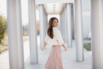 Wall Mural - Young smiling woman outdoors portrait, happy dance