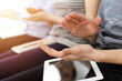© Iryna - Business people clapping at meeting or conference, close-up of hands. Group of unknown businessmen and women in sunny office