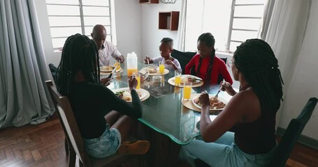 Wall Mural - African family at lunch table eating