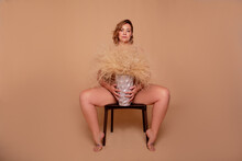 Overweight  Woman With Fat Body In Underwear Posing On Biege Studio Bsckgroung ,Concept Of Body Positive
