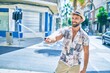 © Krakenimages.com - Young hispanic man on vacation smiling happy making selfie by the smartphone at street of city