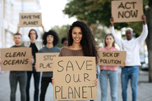 Cheerful Lady With SAVE OUR PLANET Placard
