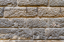 Wall Of A Medieval Building In The City Center Of Florence, Tuscany, Italy, Made Of Local Sandstone Known As "pietra Forte". Also Texture Of Medieval Bricks With Empty Space For Text.