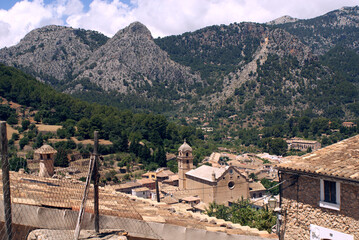 Bunyola village. Town of Mallorca with Tramuntana mountains in the background. Church and typical Balearic islands houses.	