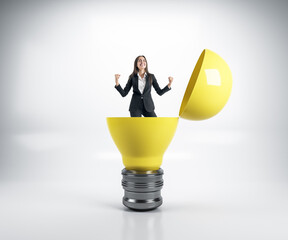 Wall Mural - Businesswoman in suit sitting in yellow lamp