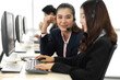 © Art_Photo - Group of happy asian smiling call center business operator customer support team phone services agen working and talking with headset on desktop computer at call center