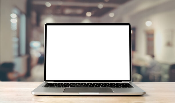Laptop blank screen on wood table with coffee cafe background, mockup, template for your text, Clipping paths included for background and device screen