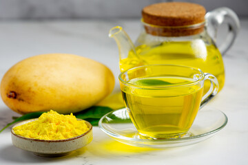 hot mango tea on table