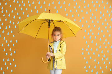 Wall Mural - Cute little girl holding umbrella on color background with drawn rain