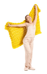 Poster - Happy young woman with warm plaid on white background