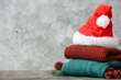 © Pixel-Shot - Stylish Christmas clothes with Santa Claus hat on grunge background