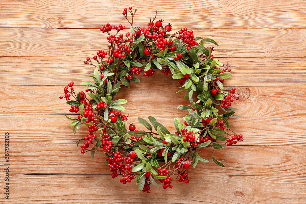 Beautiful Christmas wreath on wooden background