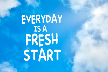 Everyday is a fresh start motivational or inspirational quote against blue sky with clouds background.
