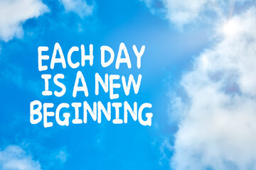 each day is a new beginning motivational or inspirational quote against blue sky with clouds backgro