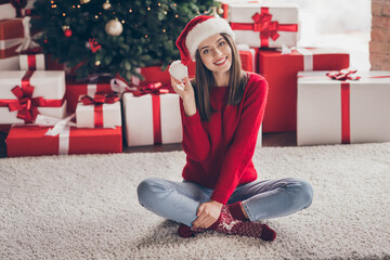 Poster - Photo of lovely lady sit carpet gift boxes play pompon wear santa headwear red pullover socks jeans in decorated x-mas living room indoors