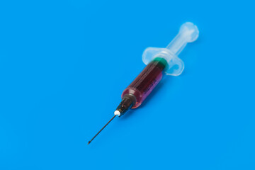 Poster - Medical syringe on blue