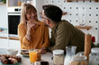 © JustLife - Young couple making sandwich at home. Loving couple enjoying in the kitchen...