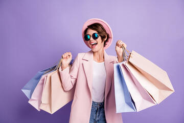 photo of amazed pretty optimistic brunette young lady do shopping wear glasses pink cap coat isolate