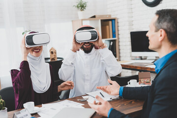 Couple studying house in virtual reality glasses. 