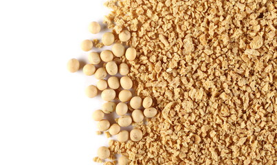 Wall Mural - Raw soybeans and soy flakes pile isolated on white background, top view