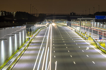 Canvas Print - Motorway with entrance of tunnel at night