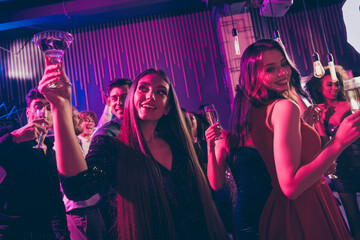 Wall Mural - Photo portrait of girl holding cocktail up dancing together at nightclub holding cocktails saying toasts