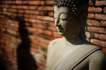 Wall Mural - Limestone Buddhist state at Wat Yai Chai Mongkhon, Ayutthaya Thailand.