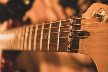 looking down electric guitar neck and strings