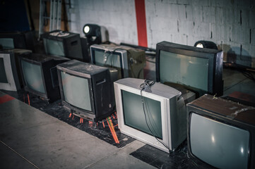 Stack of retro vintage televisions stacked. Lifestyle details, old TV set