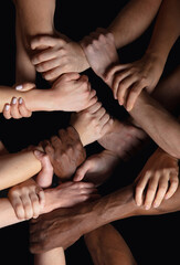 Together, peace. Hands of people's crows in touch isolated on black studio background. Concept of human relation, community, togetherness, symbolism. Hard and strong touching, creating one unit.