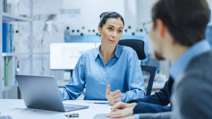 Aufkleber - Modern Factory Office Meeting Room: Confident Female Project Manager Talks to Diverse Team of Engineers, Businesspeople and Investors Sitting at the Conference. Manufacturing Facility Optimization