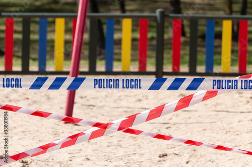Close up, horizontal shot. Playground closed by the police during the second wave of Covid19 in Madrid, to prevent its spread. Selective focus, concepts