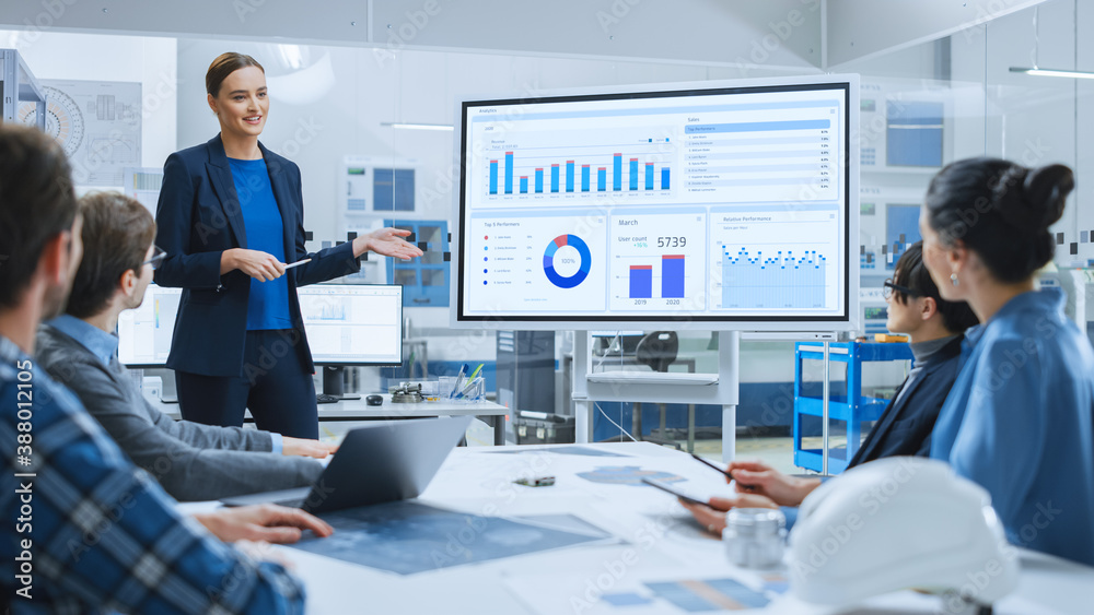 Modern Industrial Factory Meeting: Confident Female Engineer Uses ...