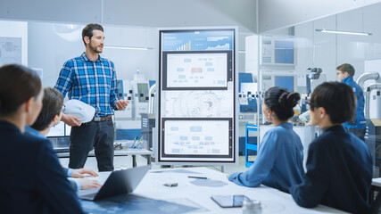 On a Meeting Chief Industrial Engineer Reports to a Group of Specialists, Managers, Uses Digital Whiteboard to Show Statistics and New Eco-Friendly Engine Concept. Sustainable Green Energy Research